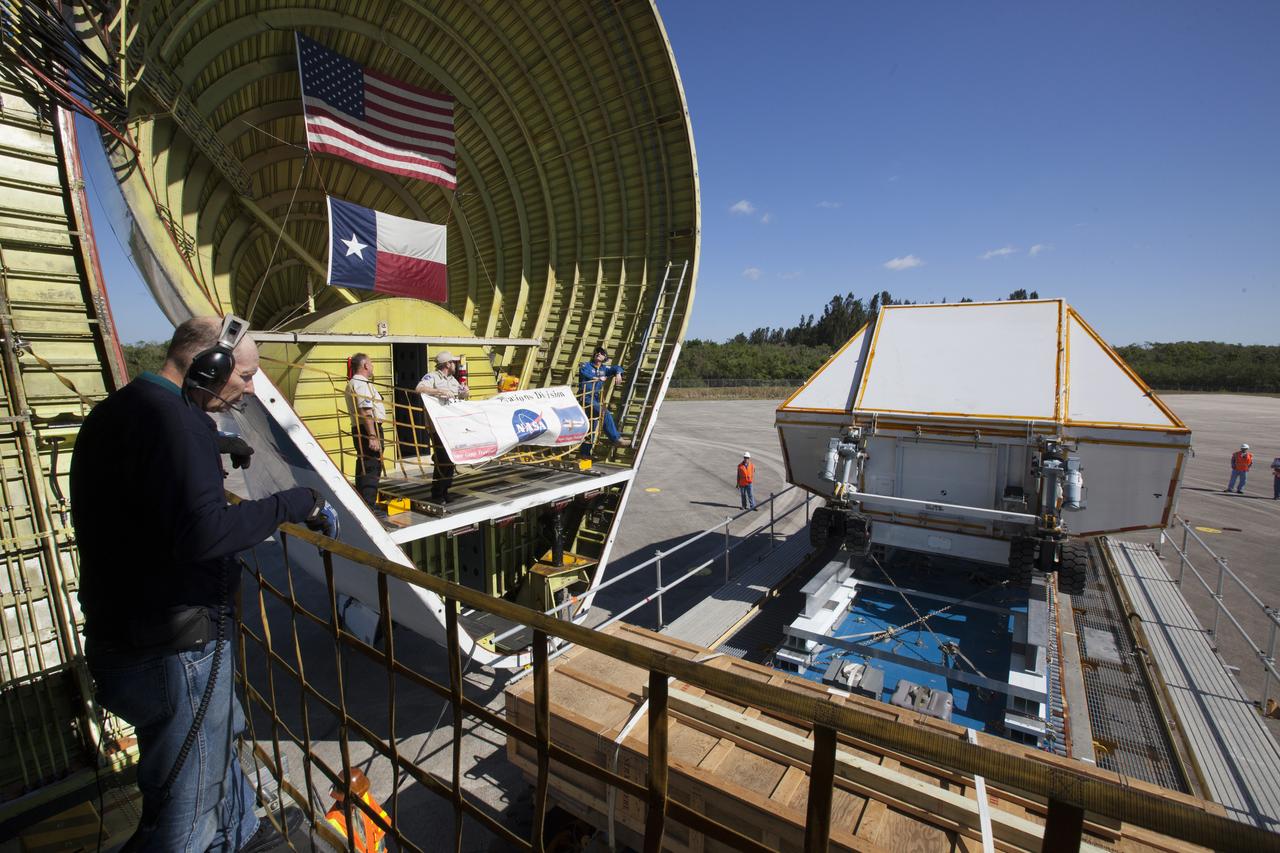 The front of NASA's Super Guppy aircraft has been opened at the Shuttle Landing Facility at NASA's Kennedy Space Center in Florida. The Orion Exploration Mission-1 (EM-1) structural test article, secured inside its transport container, will be loaded into the Super Guppy for transport to Lockheed Martin's Denver facility for testing. The Orion spacecraft will launch atop NASA’s Space Launch System rocket on EM-1, its first deep space mission.