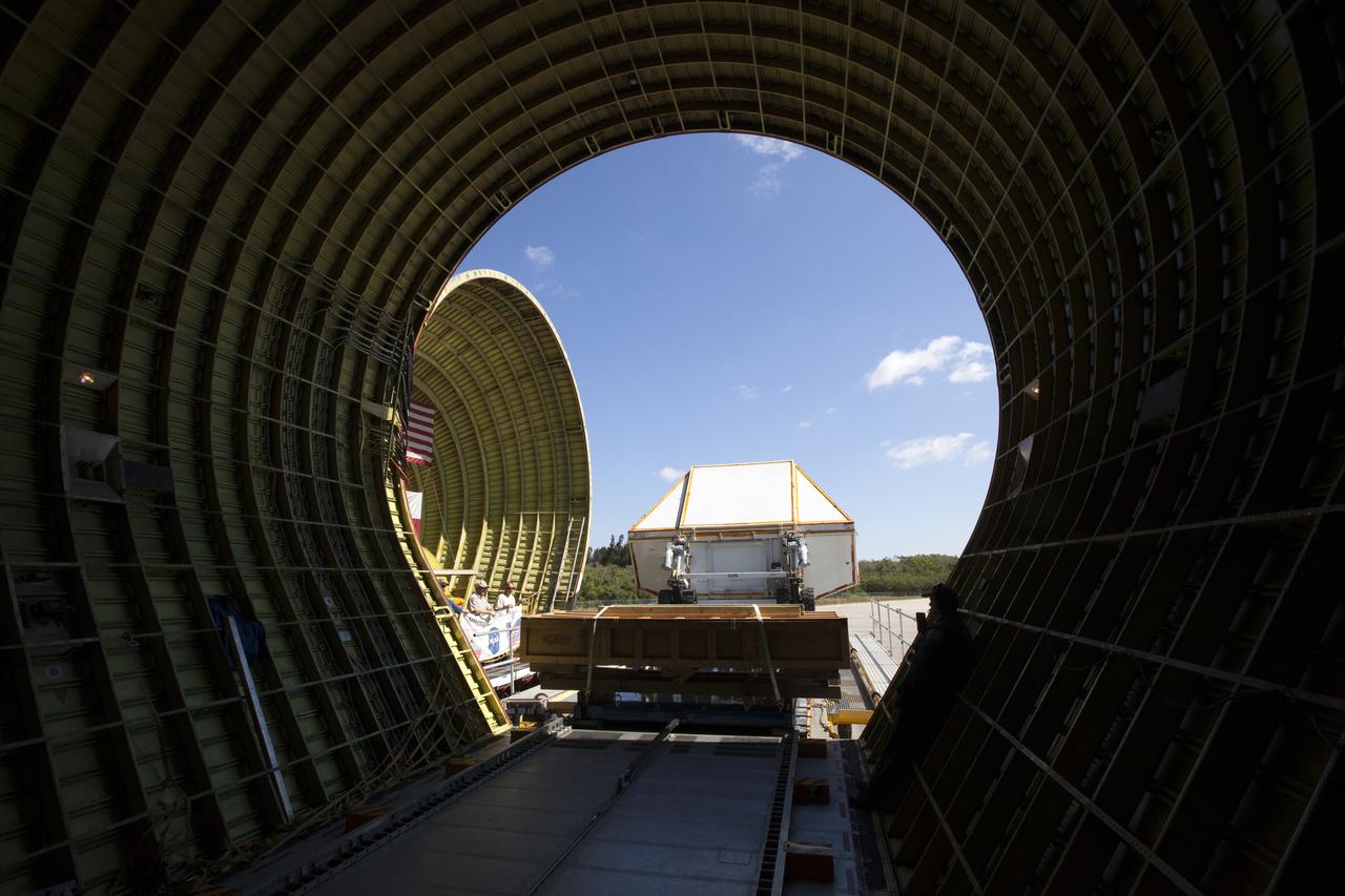 A view from inside NASA's Super Guppy aircraft at the Shuttle Landing Facility at NASA's Kennedy Space Center in Florida, as the Orion Exploration Mission-1 (EM-1) structural test article, secured inside its transport container, is loaded into the aircraft. The test article will be transported to Lockheed Martin's Denver facility for testing. The Orion spacecraft will launch atop NASA’s Space Launch System rocket on EM-1, its first deep space mission.