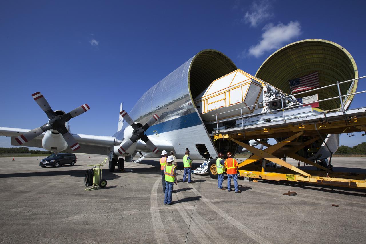 The Orion Exploration Mission-1 (EM-1) structural test article, secured inside its transport container, is loaded into NASA's Super Guppy aircraft at the Shuttle Landing Facility at NASA's Kennedy Space Center in Florida. The test article will be transported to Lockheed Martin's Denver facility for testing. The Orion spacecraft will launch atop NASA’s Space Launch System rocket on EM-1, its first deep space mission. 
