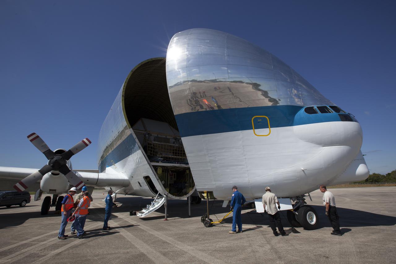 On the tarmac at the Shuttle Landing Facility at NASA's Kennedy Space Center in Florida, the agency's Super Guppy aircraft closes after the Orion Exploration Mission-1 (EM-1) structural test article, in its transport container, is secured inside. The test article will be transported to Lockheed Martin's Denver facility for testing. The Orion spacecraft will launch atop NASA’s Space Launch System rocket on EM-1, its first deep space mission. 