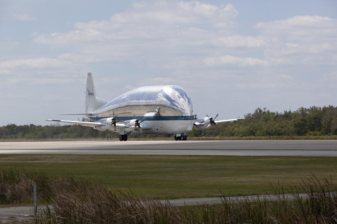 NASA's Super Guppy aircraft throttles up for takeoff on the runway at the Shuttle Landing Facility at NASA's Kennedy Space Center in Florida. The Orion Exploration Mission-1 (EM-1) structural test article, secured inside the Super Guppy, will be transported to Lockheed Martin's Denver facility for testing. The Orion spacecraft will launch atop NASA’s Space Launch System rocket on EM-1, its first deep space mission.