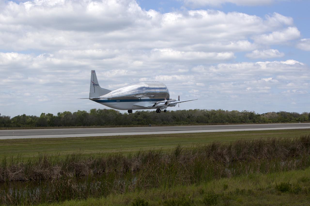 NASA's Super Guppy aircraft takes off from the runway at the Shuttle Landing Facility at NASA's Kennedy Space Center in Florida. The Orion Exploration Mission-1 (EM-1) structural test article, secured inside the Super Guppy, will be transported to Lockheed Martin's Denver facility for testing. The Orion spacecraft will launch atop NASA’s Space Launch System rocket on EM-1, its first deep space mission.