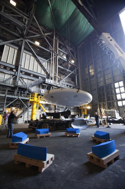 NASA image: Orion EFT-1 Heat Shield Offload from Truck onto Foam Pads (Dunna