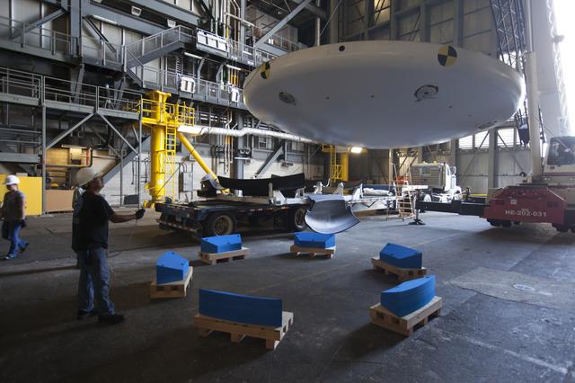 NASA image: Orion EFT-1 Heat Shield Offload from Truck onto Foam Pads (Dunna