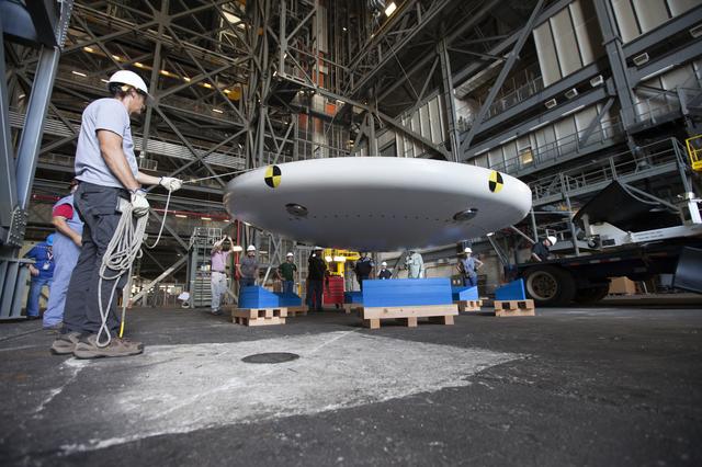NASA image: Orion EFT-1 Heat Shield Offload from Truck onto Foam Pads (Dunna