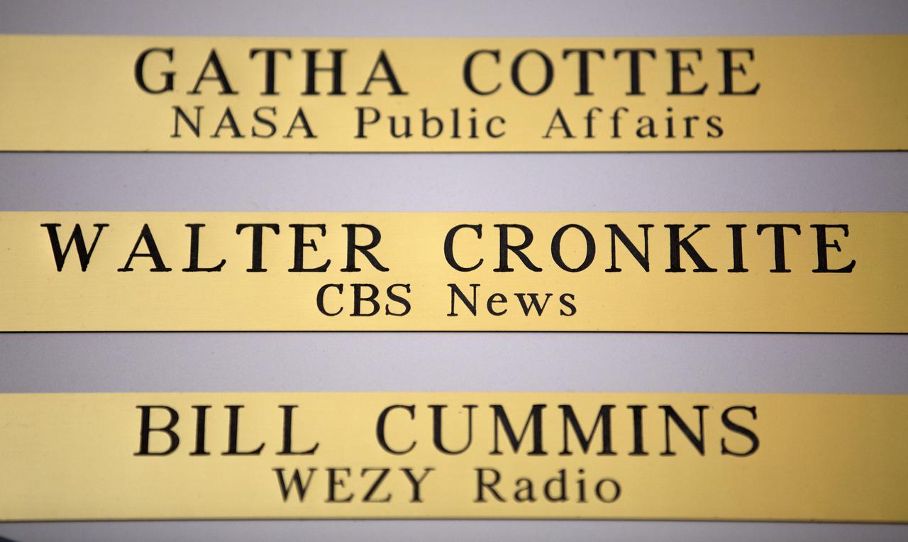 Brass plaques engraved with the names of Gatha Cottee of NASA Public Affairs, Walter Cronkite of CBS News and Bill Cummins of WEZY Radio are among the list of "The Chroniclers," a roll of honor on the wall at the NASA News Center at Kennedy Space Center in Florida. In this facility reporters from television, radio, print and online media outlets have monitored countless launches, landings and other space events in order to deliver the news to the world. The Chroniclers program recognizes retirees of the news and communications business who helped spread news of American space exploration from Kennedy Space Center for ten years or more.