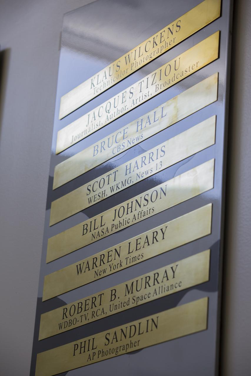 Brass strips bear the names and photos of the six new honorees added to the "Chroniclers" roll of honor in the NASA News Center at Kennedy Space Center in Florida. The Chroniclers program recognizes retirees of the news and communications business who helped spread news of American space exploration from Kennedy Space Center for ten years or more. The 2017 Chroniclers are Bruce Hall, CBS News and NBC News; Scott Harris, WESH, WKMG and Central Florida News 13; Bill Johnson, NASA Public Affairs; Warren Leary, The New York Times; Bob Murray, WDBO-TV, RCA and United Space Alliance; and Phillip Sandlin, Associated Press photographer.