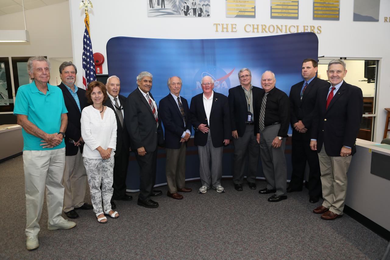 Current and retired NASA Public Affairs team members and space journalists gather in the NASA News Center at Kennedy Space Center in Florida for a ceremony in which six new honorees were added to the "Chroniclers" roll of honor. From left to right are Jay Barbree, NBC News; Al Feinberg, NASA Public Affairs; Marcia Dunn, Associated Press; Hugh Harris, NASA Public Affairs; Warren Leary, The New York Times; Phillip Sandlin, Associated Press photographer; Bob Murray, WDBO-TV, RCA and United Space Alliance; Bill Harwood, CBS News, there on behalf of the late Bruce Hall, CBS News; Bill Johnson, NASA Public Affairs; Emery McGough, son of the late Scott Harris, WESH, WKMG and Central Florida News 13; and Center Director Bob Cabana. Hall, Harris, Johnson, Leary, Murray and Sandlin are the 2017 Chroniclers. The program recognizes retirees of the news and communications business who helped spread news of American space exploration from Kennedy Space Center for ten years or more.