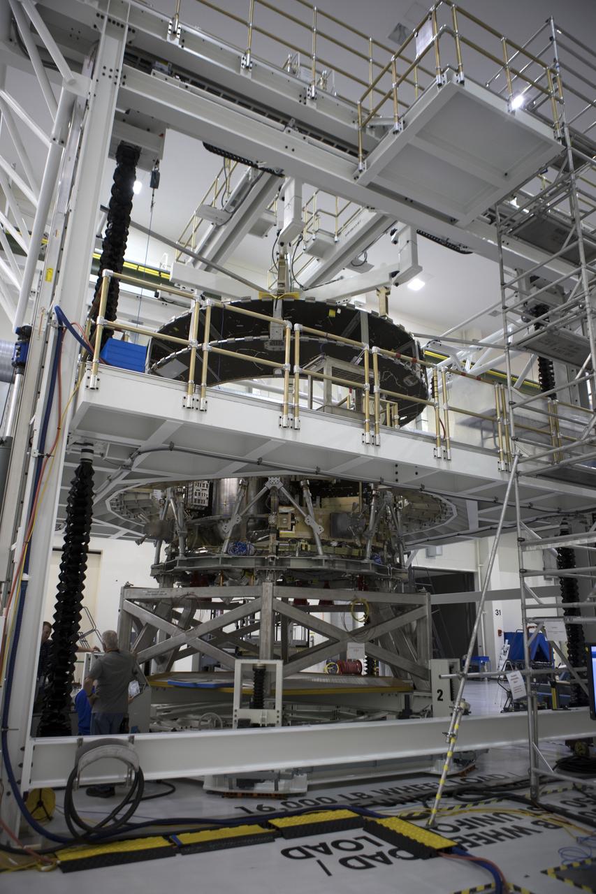 Inside the Neil Armstrong Operations and Checkout Building high bay at NASA's Kennedy Space Center in Florida, operations are underway to lower the Orion crew module adapter structural test article onto the European Space Agency's service module structural test article. After the hardware is attached, the structure will be packed and shipped to Lockheed Martin's Denver facility to undergo testing. The Orion spacecraft will launch atop the agency's Space Launch System rocket on Exploration Mission-1 in 2019.