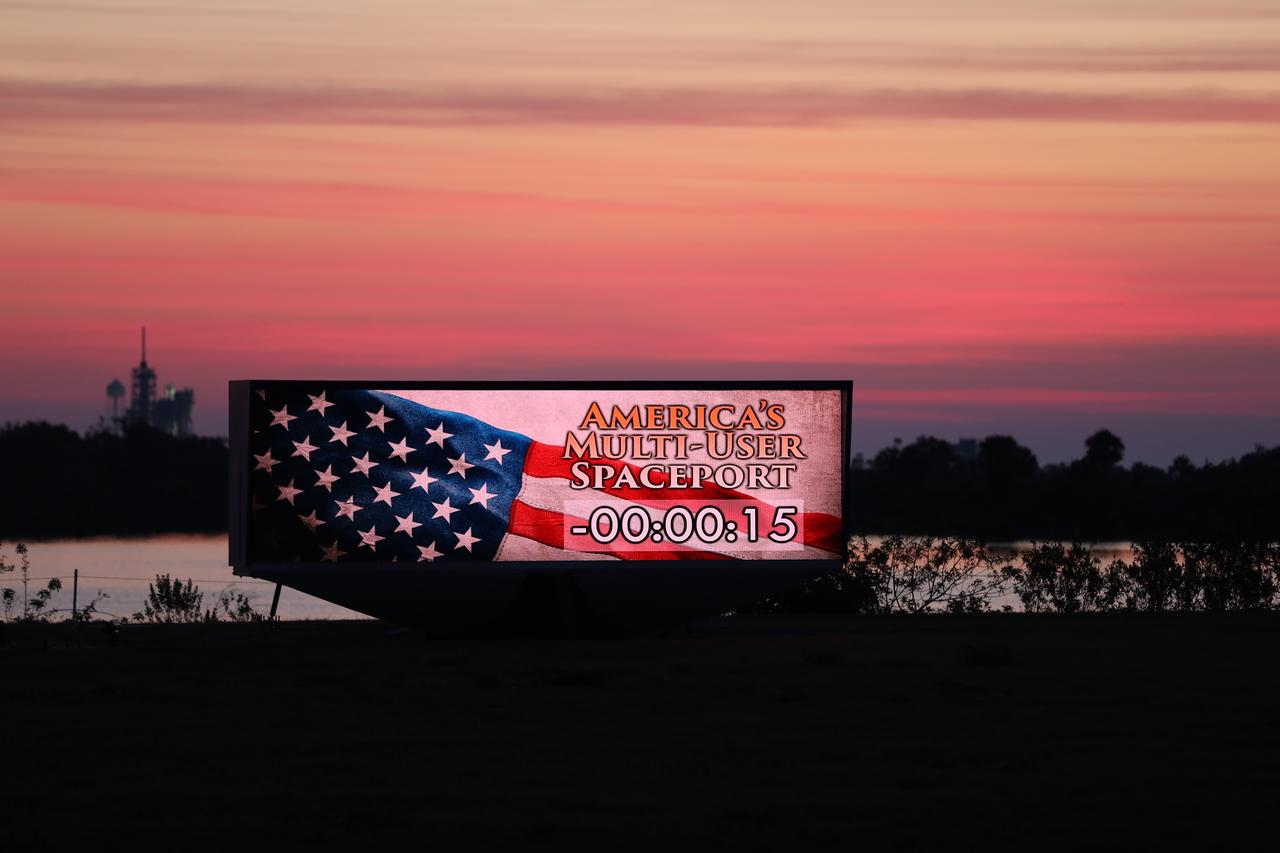 An early morning sunrise serves as the backdrop for the countdown clock near the News Center at NASA's Kennedy Space Center in Florida. 