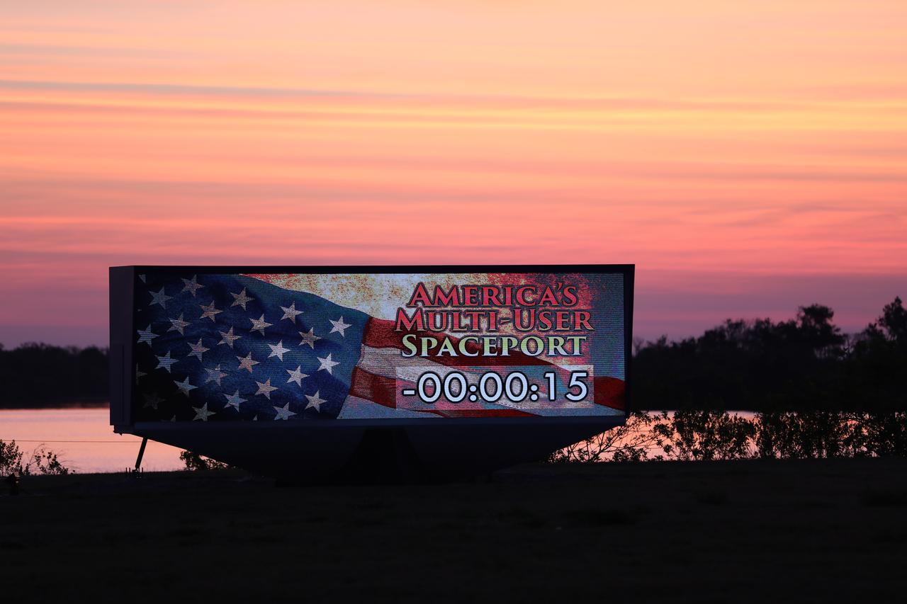 An early morning sunrise serves as the backdrop for the countdown clock near the News Center at NASA's Kennedy Space Center in Florida. 