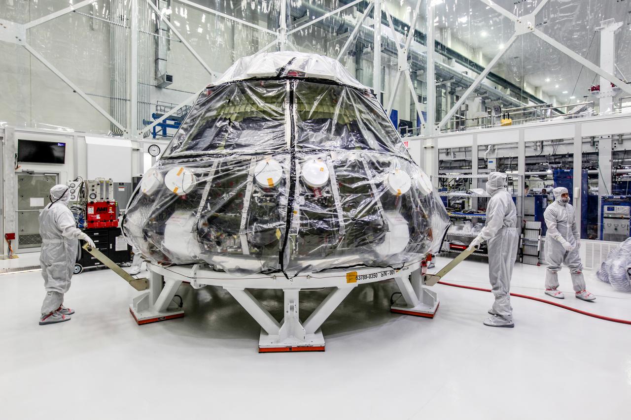 The Orion crew module pressure vessel for NASA’s Exploration Mission 1 (EM-1) is being moved from a clean room to a work station inside the Neil Armstrong Operations and Checkout Building high bay at NASA’s Kennedy Space Center in Florida. Orion will undergo additional processing to prepare it for launch in 2019. The spacecraft is being prepared for its first integrated flight atop the Space Launch System rocket on Exploration Mission-1. 
