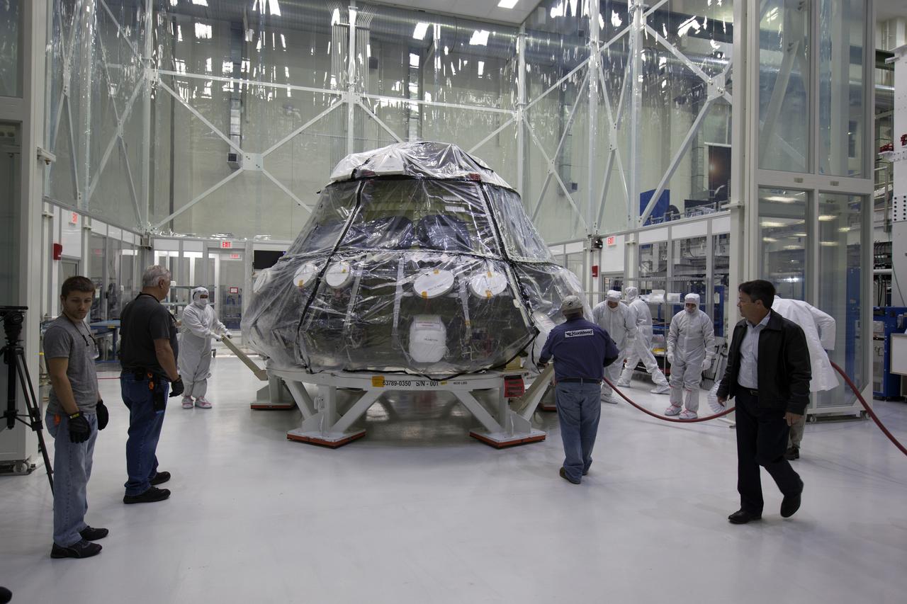 The Orion crew module pressure vessel for NASA’s Exploration Mission 1 (EM-1) is being moved from a clean room to a work station inside the Neil Armstrong Operations and Checkout Building high bay at NASA’s Kennedy Space Center in Florida. Orion will undergo additional processing to prepare it for launch in 2019. The spacecraft is being prepared for its first integrated flight atop the Space Launch System rocket on Exploration Mission-1.