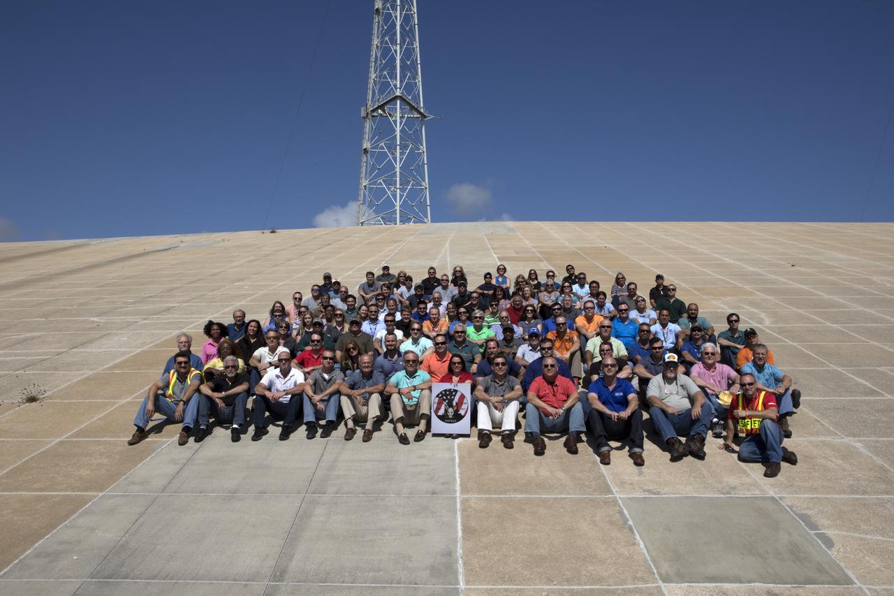 Launch Complex 39B current and past NASA and contractor workers gathered at pad B to mark the 50th anniversary of the launch complex at NASA's Kennedy Space Center in Florida. Upgrades to the surface of pad B, as well as the systems below and surrounding the pad will support the new processing and launch requirements for NASA's Space Launch System (SLS) and the Orion spacecraft for deep-space missions, including the journey to Mars. The modifications and improvements to processing and launch facilities will support Kennedy as a multi-user spaceport for government and commercial launches for years to come. The Ground Systems Development and Operations Program is overseeing upgrades and modifications to Pad 39B.