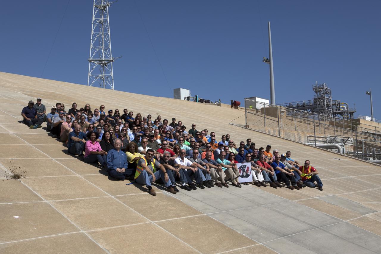Launch Complex 39B current and past NASA and contractor workers gathered at pad B to mark the 50th anniversary of the launch complex at NASA's Kennedy Space Center in Florida. Upgrades to the surface of pad B, as well as the systems below and surrounding the pad will support the new processing and launch requirements for NASA's Space Launch System (SLS) and the Orion spacecraft for deep-space missions, including the journey to Mars. The modifications and improvements to processing and launch facilities will support Kennedy as a multi-user spaceport for government and commercial launches for years to come. The Ground Systems Development and Operations Program is overseeing upgrades and modifications to Pad 39B.