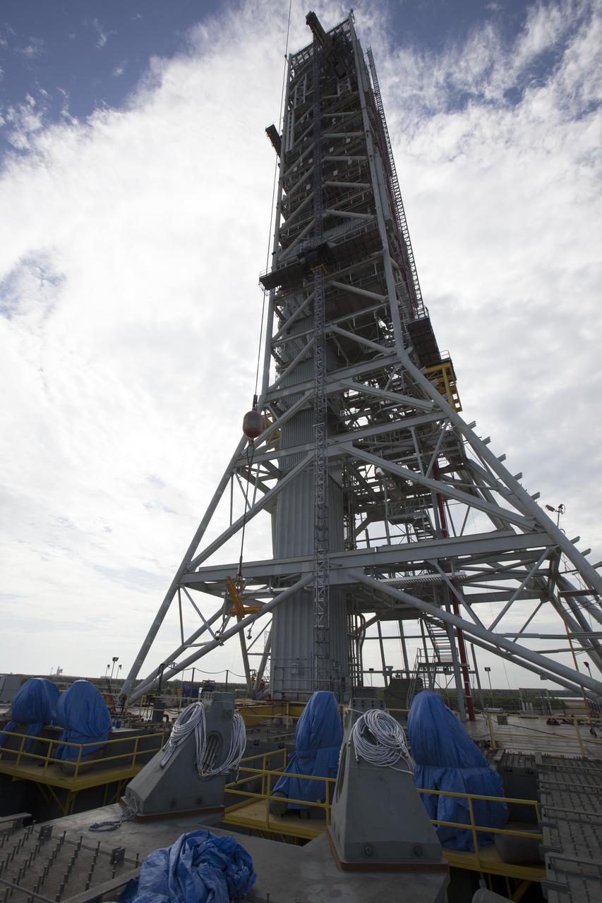 At NASA's Kennedy Space Center in Florida, the final four vehicle support posts are being installed on the deck of the mobile launcher. A total of eight support posts are being installed to support the load of the Space Launch System's (SLS) solid rocket boosters, with four posts for each of the boosters. The support posts are about five feet tall and each weigh about 10,000 pounds. The posts will structurally support the SLS rocket through T-0 and liftoff, and will drop down before vehicle liftoff to avoid contact with the flight hardware. The Ground Systems Development and Operations Program is overseeing installation of the support posts to prepare for the launch of the Orion spacecraft atop the SLS rocket.