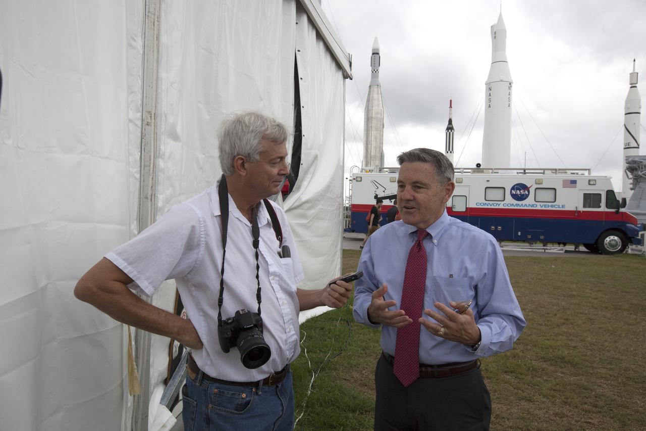 NASA Kennedy Space Center Director Bob Cabana, at right, talks with Ken Kremer, Universe Today, during media day at the agency's 8th Annual Robotic Mining Competition at the Kennedy Space Center Visitor Complex in Florida. Cabana shared his thoughts about the competition and the progress made to make Kennedy a multi-user spaceport. Teams from colleges and universities around the U.S. used their mining robots to dig in a supersized sandbox filled with BP-1, or simulated Martian soil, and participated in other competition requirements, May 22-26. The Robotic Mining Competition is a NASA Human Exploration and Operations Mission Directorate project designed to encourage students in science, technology, engineering and math, or STEM fields. The project provides a competitive environment to foster innovative ideas and solutions that could be used on NASA's Journey to Mars. 