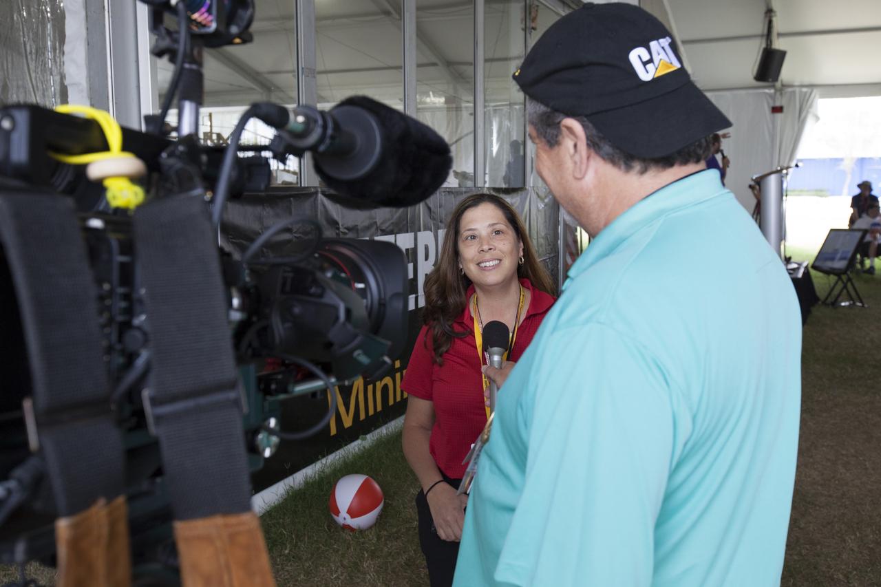 Lilliana Villareal, Spacecraft and Offline Operations manager in the Ground Systems Development and Operations Program, is interviewed on-camera by Al Feinberg, with the Communications and Public Engagement Directorate, during NASA's 8th Annual Robotic Mining Competition at the Kennedy Space Center Visitor Complex in Florida. More than 40 student teams from colleges and universities around the U.S. used their uniquely-designed mining robots to dig in a supersized sandbox filled with BP-1, or simulated Martian soil, and participated in other competition requirements, May 22-26. The Robotic Mining Competition is a NASA Human Exploration and Operations Mission Directorate project designed to encourage students in science, technology, engineering and math, or STEM fields. The project provides a competitive environment to foster innovative ideas and solutions that could be used on NASA's Journey to Mars. 