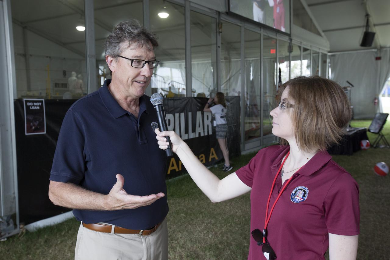 Stan Starr, branch chief for Applied Physics in the Exploration Research and Technology Programs, is interviewed on-camera by Sarah McNulty, with the Communication and Public Engagement Directorate, during NASA's 8th Annual Robotic Mining Competition at the Kennedy Space Center Visitor Complex in Florida. More than 40 student teams from colleges and universities around the U.S. used their uniquely-designed mining robots to dig in a supersized sandbox filled with BP-1, or simulated Martian soil, and participated in other competition requirements, May 22-26. The Robotic Mining Competition is a NASA Human Exploration and Operations Mission Directorate project designed to encourage students in science, technology, engineering and math, or STEM fields. The project provides a competitive environment to foster innovative ideas and solutions that could be used on NASA's Journey to Mars. 