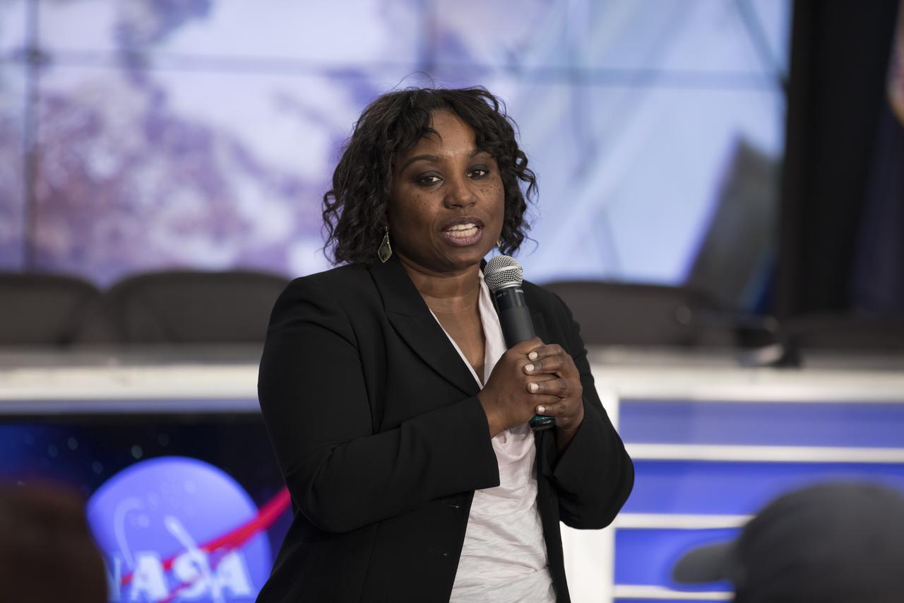 Dr. Camille Alleyne, associate program scientist for the International Space Station (ISS) at NASA’s Johnson Space Center, speaks to members of social media in the Kennedy Space Center’s Press Site auditorium. The briefing focused on research planned for launch to the International Space Station. The scientific materials and supplies will be aboard a Dragon spacecraft scheduled for launch from Kennedy’s Launch Complex 39A on June 1 atop a SpaceX Falcon 9 rocket on the company's 11th Commercial Resupply Services mission to the space station.