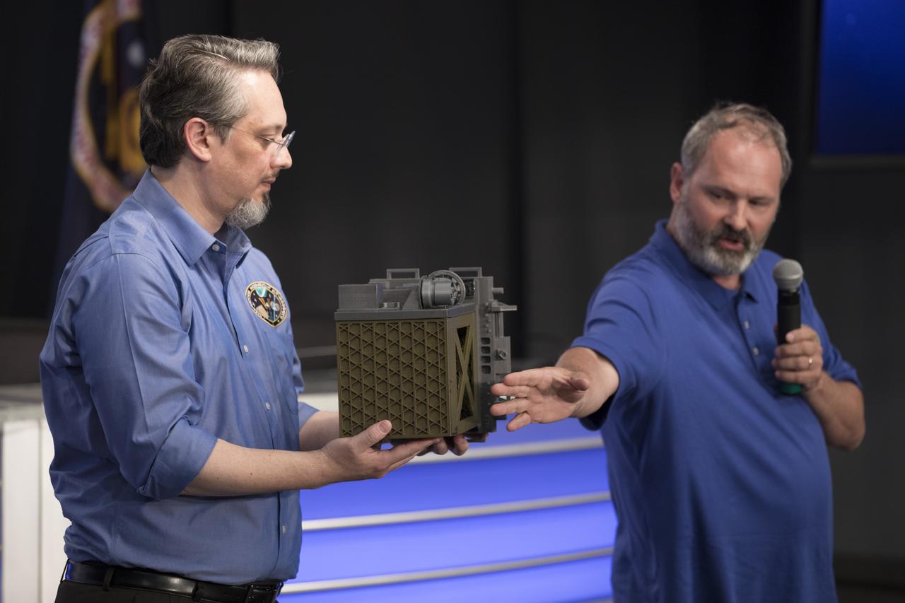 Jason Mitchell, project manager for the Station Explorer for X-ray Timing and Navigation Technology, or SEXTANT, instrument, left, and Keith Gendreau, principle investigator for the Neutron star Interior Composition Explorer, or NICER, speak to members of social media in the Kennedy Space Center’s Press Site auditorium. The briefing focused on the purpose of their experiments and instruments to be delivered to the International Space Station on SpaceX CRS-11. A Dragon spacecraft is scheduled to be launched from Kennedy’s Launch Complex 39A on June 1 atop a SpaceX Falcon 9 rocket on the company's 11th Commercial Resupply Services mission to the space station.