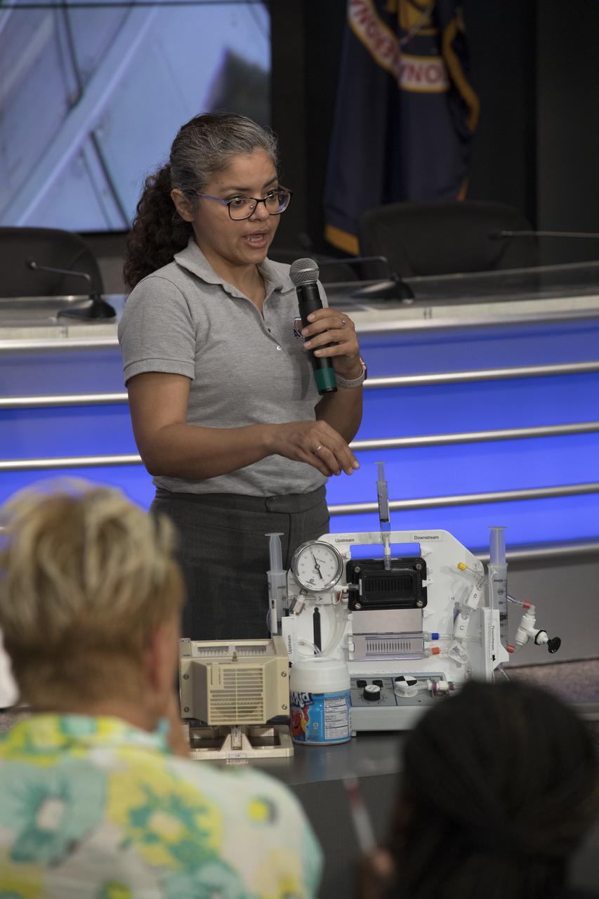 Miriam Sargusingh, project lead for the Capillary Structures for Exploration Life Support, or CSELS, experiment, speaks to members of social media in the Kennedy Space Center’s Press Site auditorium. The briefing focused on experiments and instruments to be delivered to the International Space Station on SpaceX CRS-11. A Dragon spacecraft is scheduled to be launched from Kennedy’s Launch Complex 39A on June 1 atop a SpaceX Falcon 9 rocket on the company's 11th Commercial Resupply Services mission to the space station.