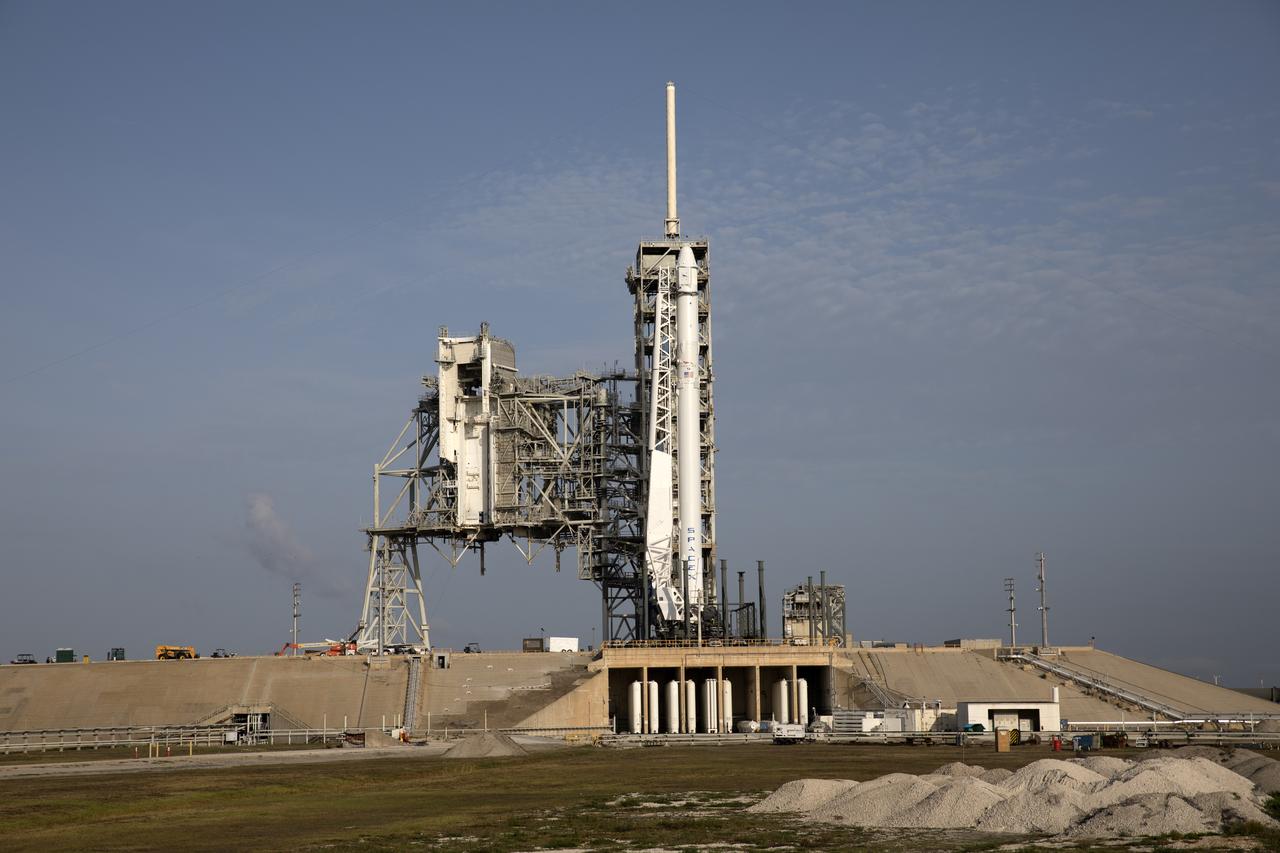 As a Falcon 9 rocket stands ready for liftoff at the Kennedy Space Center's Launch Complex 39A. The rocket will boost a Dragon resupply spacecraft to the International Space Station. Liftoff is scheduled for 5:55 p.m. EDT. On its 11th commercial resupply services mission to the space station, Dragon will bring up 6,000 pounds of supplies, such as the Neutron star Interior Composition Explorer, or NICER, instrument to study the extraordinary physics of neutron stars. 