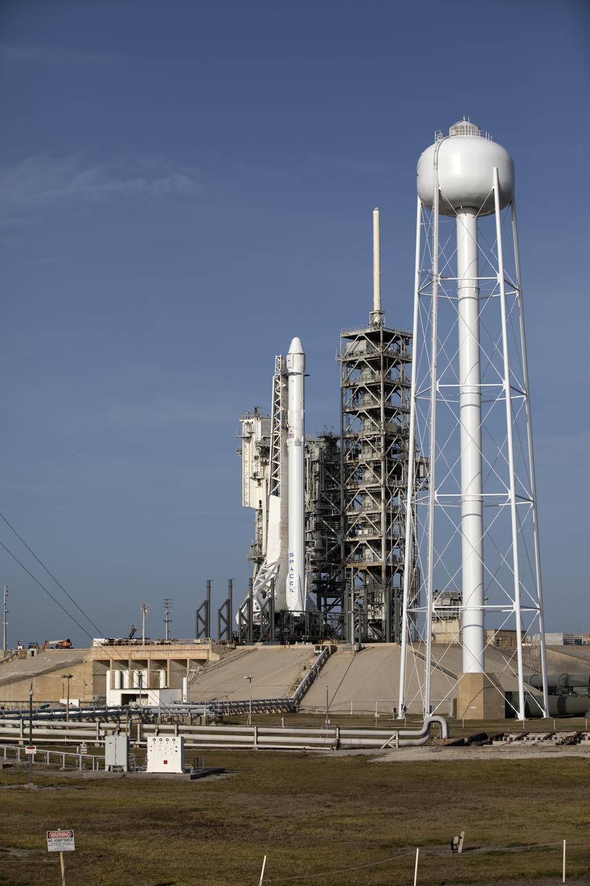As a Falcon 9 rocket stands ready for liftoff at the Kennedy Space Center's Launch Complex 39A. The rocket will boost a Dragon resupply spacecraft to the International Space Station. Liftoff is scheduled for 5:55 p.m. EDT. On its 11th commercial resupply services mission to the space station, Dragon will bring up 6,000 pounds of supplies, such as the Neutron star Interior Composition Explorer, or NICER, instrument to study the extraordinary physics of neutron stars. 