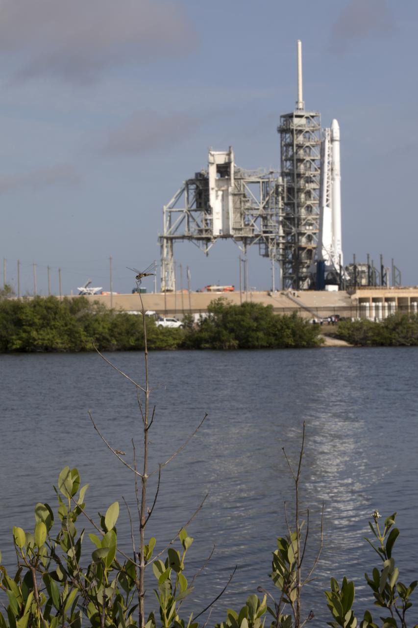 As a Falcon 9 rocket stands ready for liftoff at the Kennedy Space Center's Launch Complex 39A. The rocket will boost a Dragon resupply spacecraft to the International Space Station. Liftoff is scheduled for 5:55 p.m. EDT. On its 11th commercial resupply services mission to the space station, Dragon will bring up 6,000 pounds of supplies, such as the Neutron star Interior Composition Explorer, or NICER, instrument to study the extraordinary physics of neutron stars. 