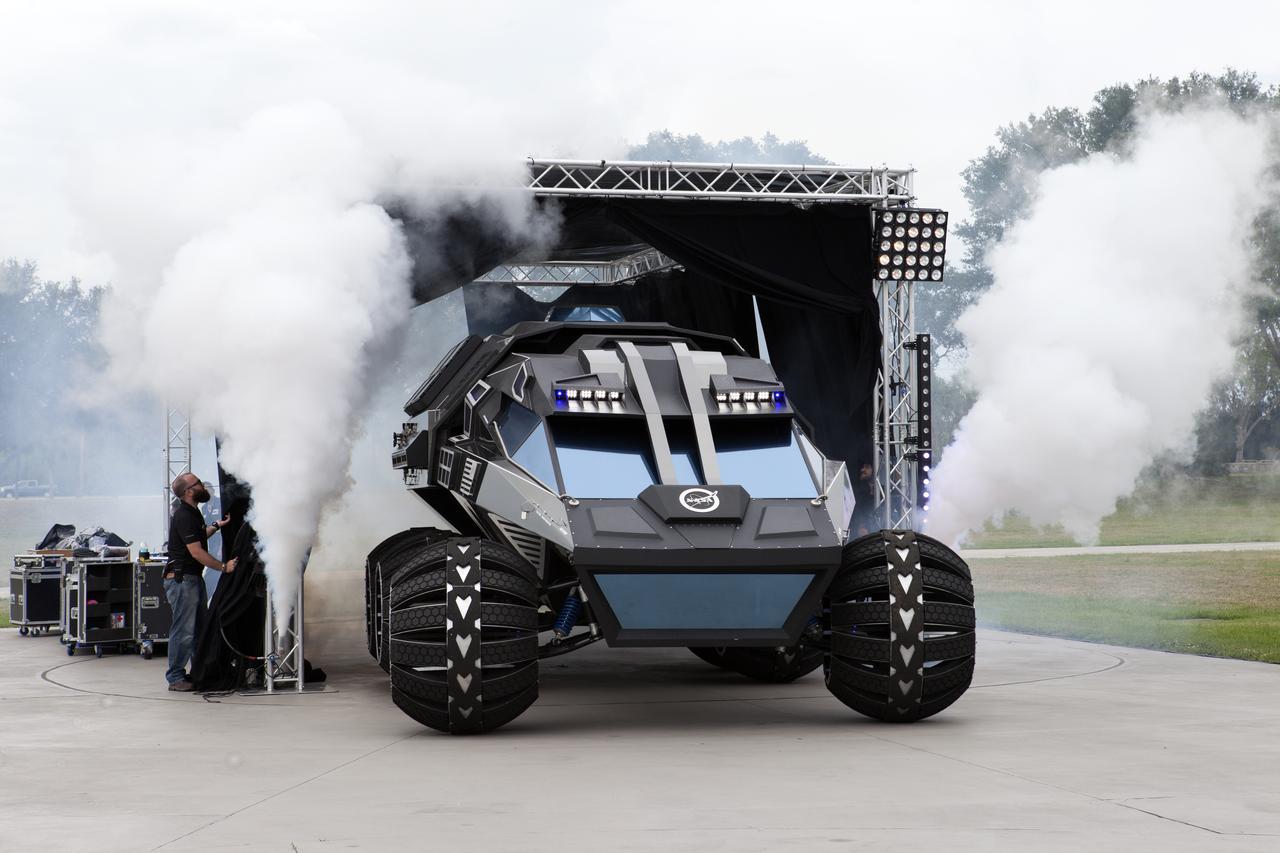 The scientifically-themed Mars rover concept vehicle operates on an electric motor, powered by solar panels and a 700-volt battery. The rover separates in the middle with the front area designed for scouting and equipped with a radio and navigation provided by the Global Positioning System. The back section serves as a full laboratory which can disconnect for autonomous research. The "Summer of Mars" promotion is designed to provide guests with a better understanding of NASA's studies of the Red Planet. The builders of the rover, Parker Brothers Concepts of Port Canaveral, Florida, incorporated input into its design from NASA subject matter experts.