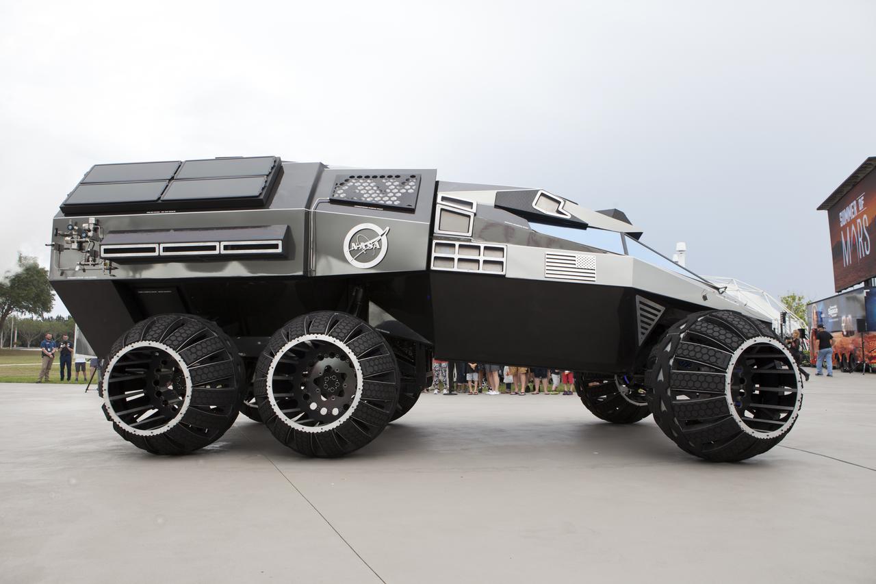 The scientifically-themed Mars rover concept vehicle operates on an electric motor, powered by solar panels and a 700-volt battery. The rover separates in the middle with the front area designed for scouting and equipped with a radio and navigation provided by the Global Positioning System. The back section serves as a full laboratory which can disconnect for autonomous research. The "Summer of Mars" promotion is designed to provide guests with a better understanding of NASA's studies of the Red Planet. The builders of the rover, Parker Brothers Concepts of Port Canaveral, Florida, incorporated input into its design from NASA subject matter experts.