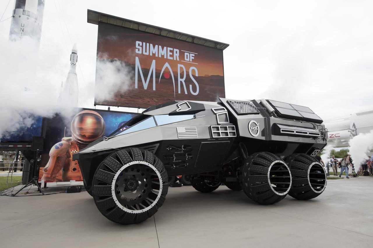 The scientifically-themed Mars rover concept vehicle operates on an electric motor, powered by solar panels and a 700-volt battery. The rover separates in the middle with the front area designed for scouting and equipped with a radio and navigation provided by the Global Positioning System. The back section serves as a full laboratory which can disconnect for autonomous research. The "Summer of Mars" promotion is designed to provide guests with a better understanding of NASA's studies of the Red Planet. The builders of the rover, Parker Brothers Concepts of Port Canaveral, Florida, incorporated input into its design from NASA subject matter experts.