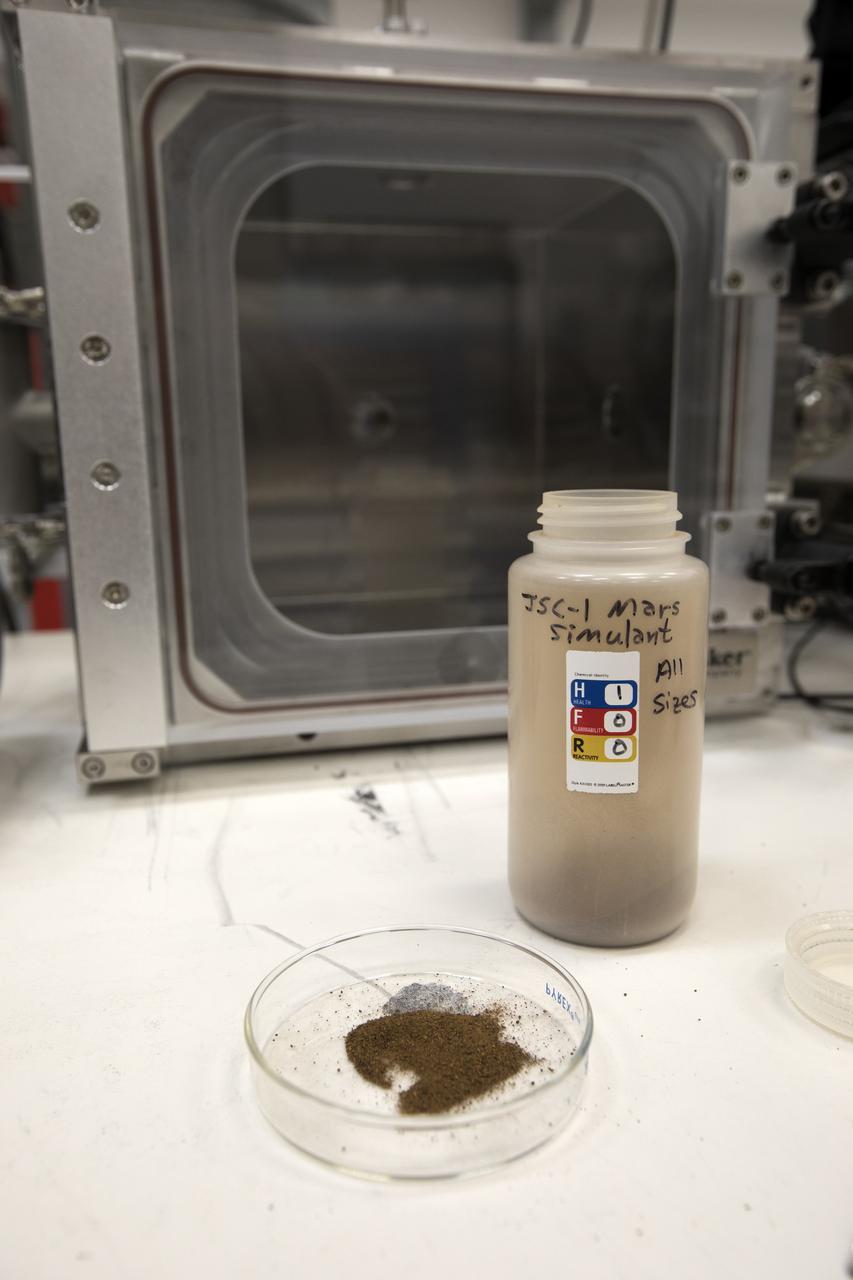 In their Swamp Works laboratory at NASA's Kennedy Space Center, Dr. Carlos Calle and Jay Phillips are testing an electrostatic precipitator using dust that closely approximates the make-up of that on Mars. They upgraded their electrostatic precipitator to fully simulate Martian atmosphere by designing and constructing a dust aerosolization pre-chamber. The agency's Journey to Mars requires cutting-edge technologies to solve the problems explorers will face on the Red Planet. Scientists are developing some of the needed solutions by adapting a device to remove the ever-present dust from valuable elements in the Martian atmosphere. Those commodities include oxygen, water and methane.