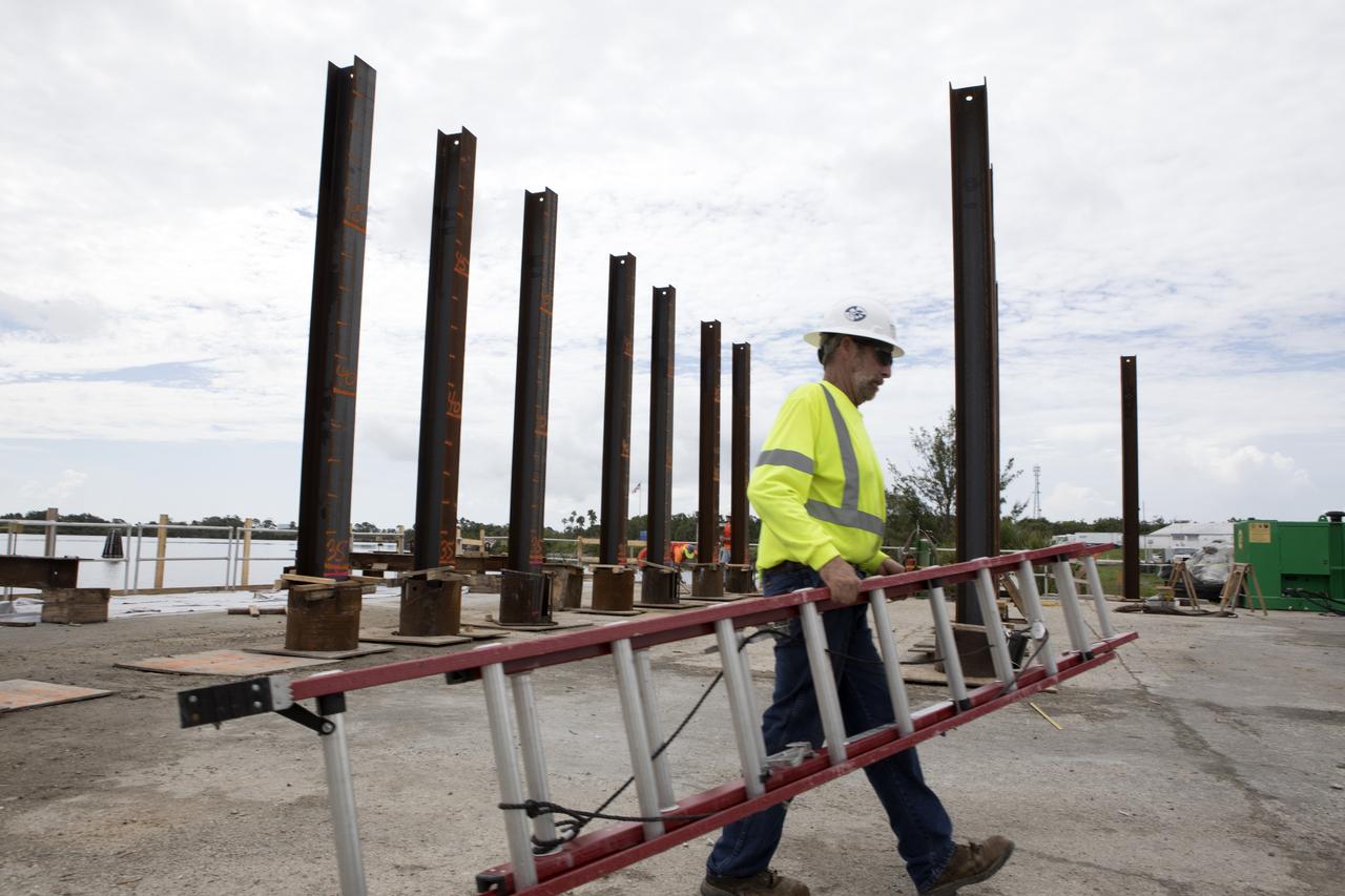 Modifications are underway at the Launch Complex 39 turn basin wharf at NASA's Kennedy Space Center in Florida to prepare for the arrival of the agency's massive Space Launch System (SLS) core stage aboard the barge Pegasus. Precast concrete poles are being driven to a depth of about 70 feet into the bedrock below the water around the turn basin. The upgrades are necessary to accommodate the increased weight of the core stage along with ground support and transportation equipment aboard the modified barge Pegasus. The Ground Systems Development and Operations Program is overseeing the upgrades to the turn basin wharf. 
