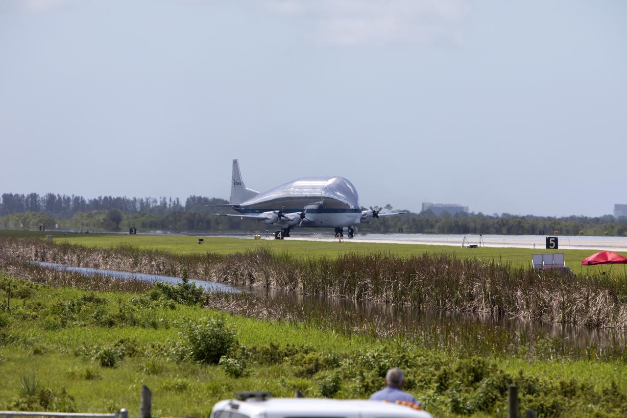 NASA's Super Guppy aircraft touches down at the Shuttle Landing Facility, managed and operated by Space Florida, at Kennedy Space Center in Florida. The Orion service module structural test article for Exploration Mission-1 (EM-1), built by the European Space Agency, will be loaded into the Guppy for shipment to Lockheed Martin's Denver facility to undergo testing. The Orion spacecraft will launch atop the agency's Space Launch System rocket on EM-1 in 2019. 