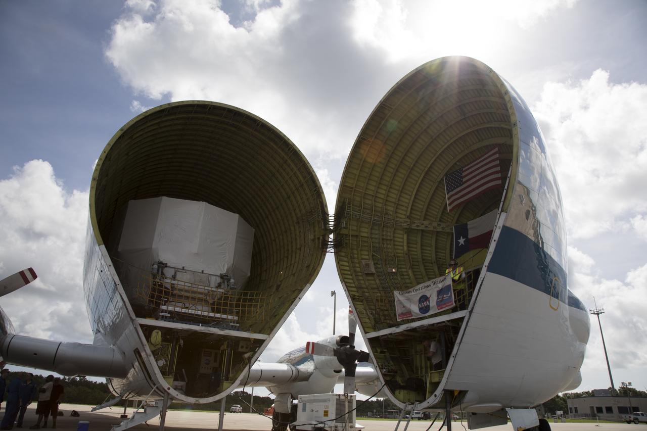 The Orion service module structural test article for Exploration Mission-1 (EM-1), built by the European Space Agency, is secured inside NASA's Super Guppy aircraft at Kennedy Space Center's Shuttle Landing Facility, managed by Space Florida. The module will be shipped to Lockheed Martin's Denver facility to undergo testing. The Orion spacecraft will launch atop the agency's Space Launch System rocket on EM-1 in 2019.