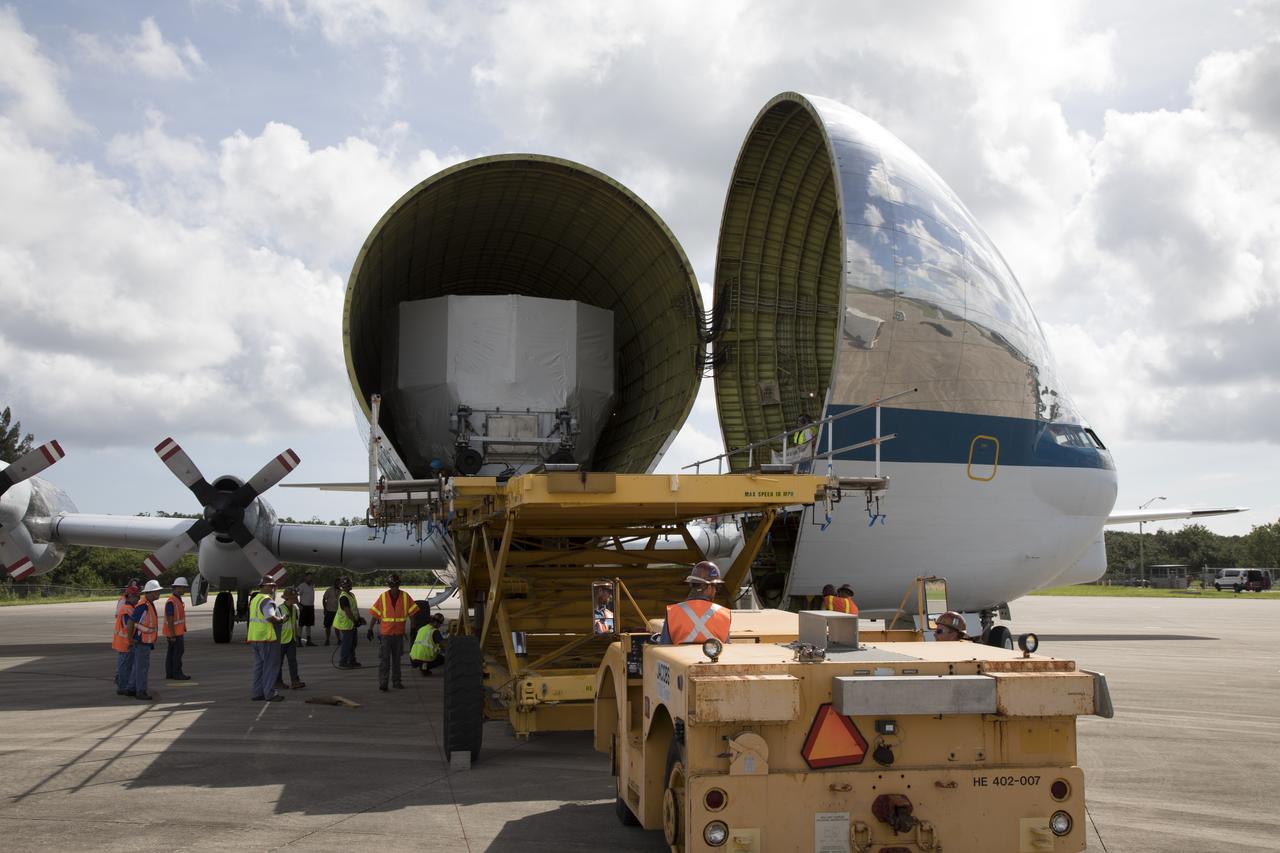 The Orion service module structural test article for Exploration Mission-1 (EM-1), built by the European Space Agency, is moved inside NASA's Super Guppy aircraft at Kennedy Space Center's Shuttle Landing Facility, managed by Space Florida. The module will be secured inside the aircraft and shipped to Lockheed Martin's Denver facility to undergo testing. The Orion spacecraft will launch atop the agency's Space Launch System rocket on EM-1 in 2019. 