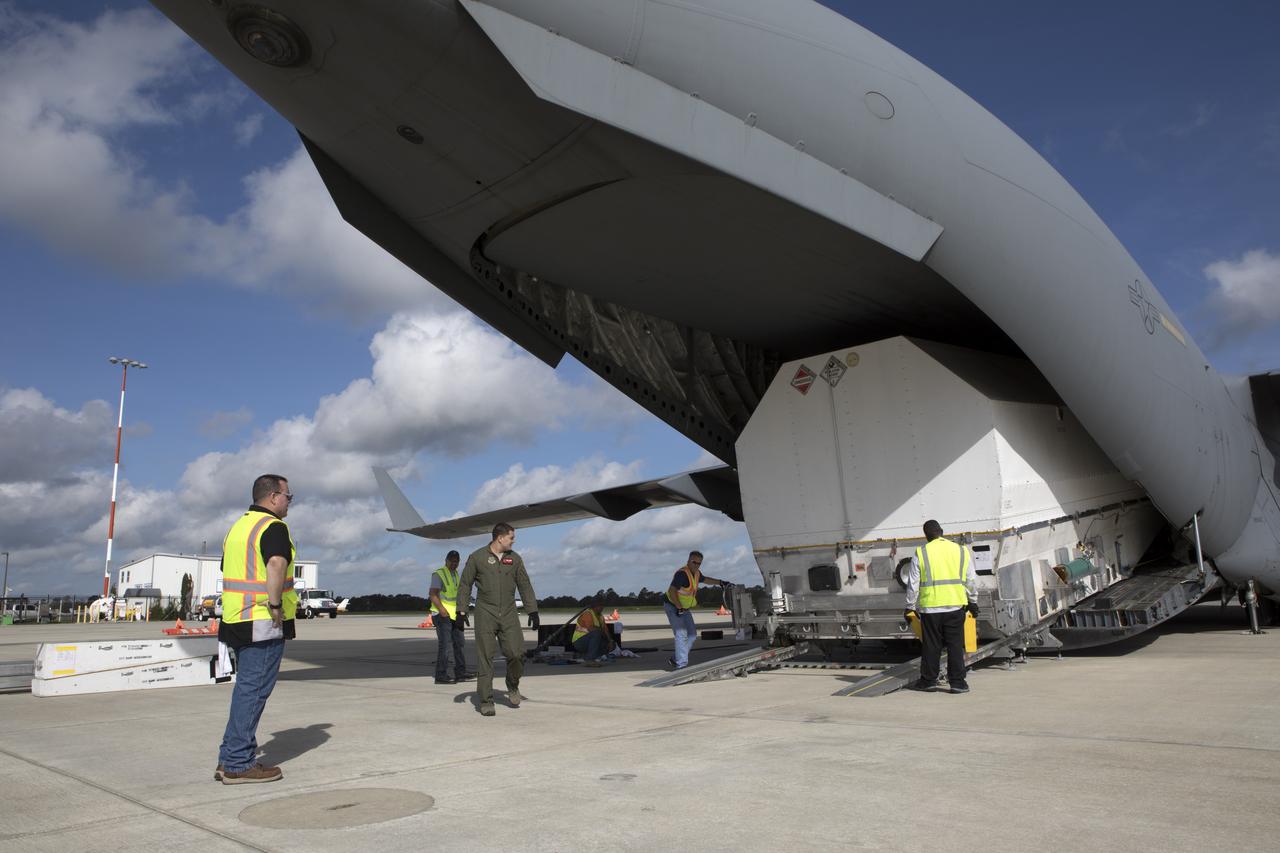 NASA's TDRS-M satellite arrives inside its shipping container at Space Coast Regional Airport in Titusville, Florida, aboard a U.S. Air Force transport aircraft. The spacecraft will be transported to the nearby Astrotech facility, also in Titusville, for preflight processing. The TDRS-M is the latest spacecraft destined for the agency's constellation of communications satellites that allows nearly continuous contact with orbiting spacecraft ranging from the International Space Station and Hubble Space Telescope to the array of scientific observatories. Liftoff atop a United Launch Alliance Atlas V rocket is scheduled to take place from Space Launch Complex 41 at Cape Canaveral Air Force Station at 9:02 a.m. EDT Aug. 3, 2017.