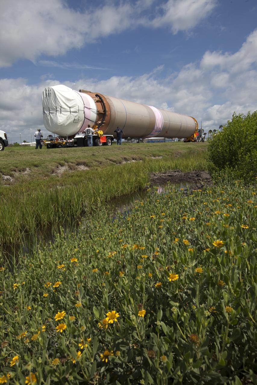 A United Launch Alliance Atlas V rocket booster is transported to the Atlas Spaceflight Operations Center at Cape Canaveral Air Force Station in Florida. The rocket is scheduled to launch the Tracking and Data Relay Satellite, TDRS-M. It will be the latest spacecraft destined for the agency's constellation of communications satellites that allows nearly continuous contact with orbiting spacecraft ranging from the International Space Station and Hubble Space Telescope to the array of scientific observatories. Liftoff atop the ULA Atlas V rocket is scheduled to take place from Cape Canaveral's Space Launch Complex 41 on Aug. 3, 2017 at 9:02 a.m. EDT.
