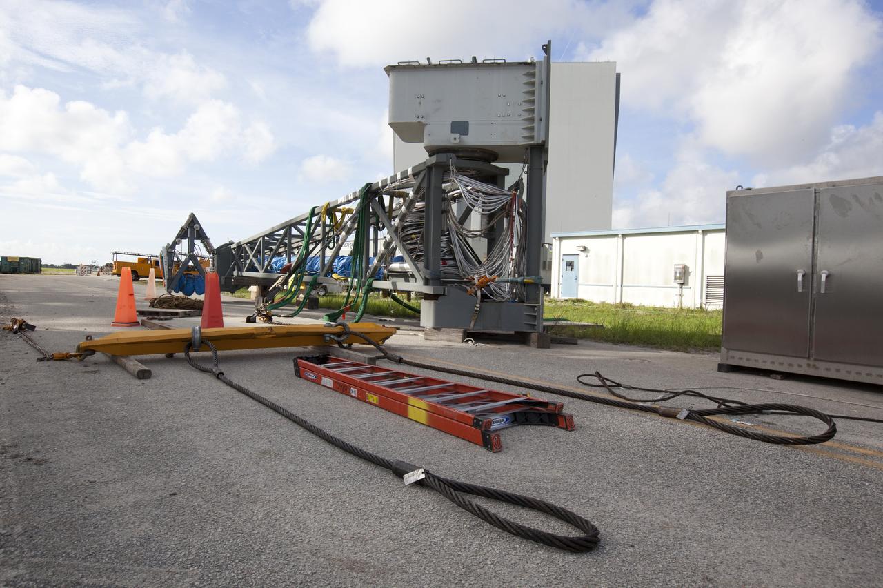 Just north of the Vehicle Assembly Building at NASA's Kennedy Space Center in Florida, the core stage forward skirt umbilical is prepped and rigged for installation onto the mobile launcher. The mobile launcher is designed to support the assembly, testing and check-out of the agency's Space Launch System (SLS) rocket and the Orion spacecraft.