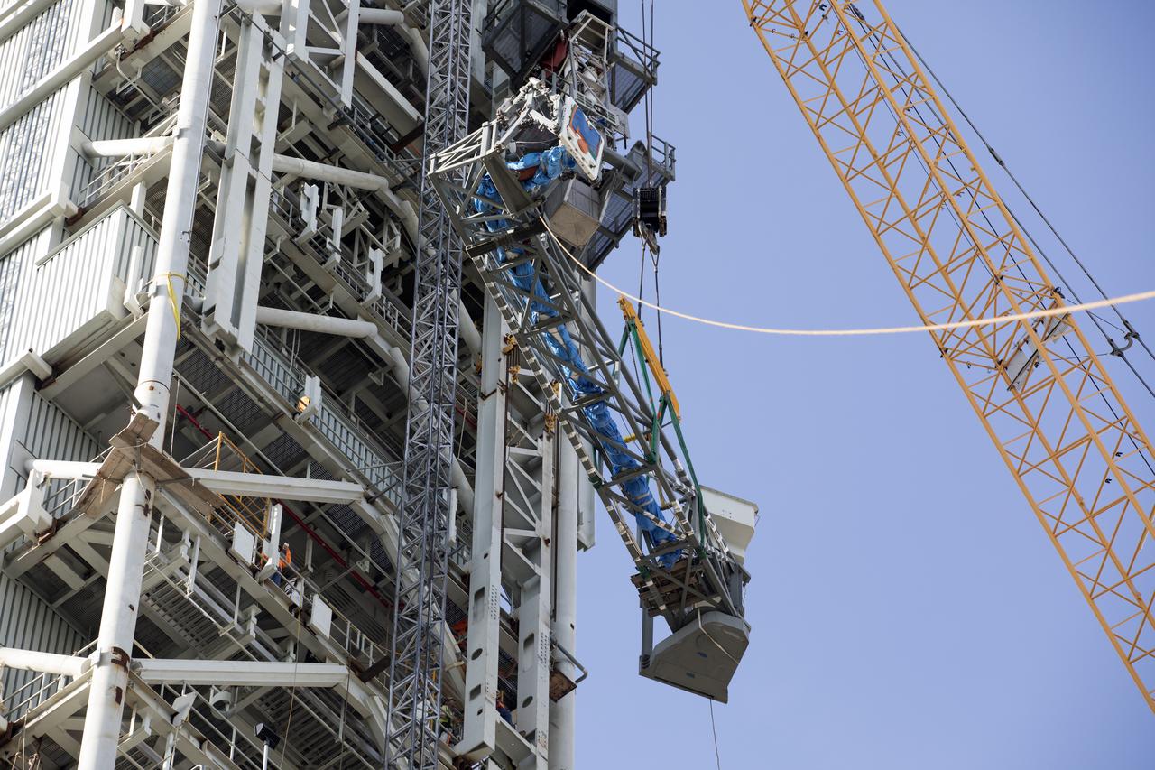 Just north of the Vehicle Assembly Building at NASA's Kennedy Space Center in Florida, the core stage forward skirt umbilical is installed on the mobile launcher. The mobile launcher is designed to support the assembly, testing and check-out of the agency's Space Launch System (SLS) rocket and the Orion spacecraft.