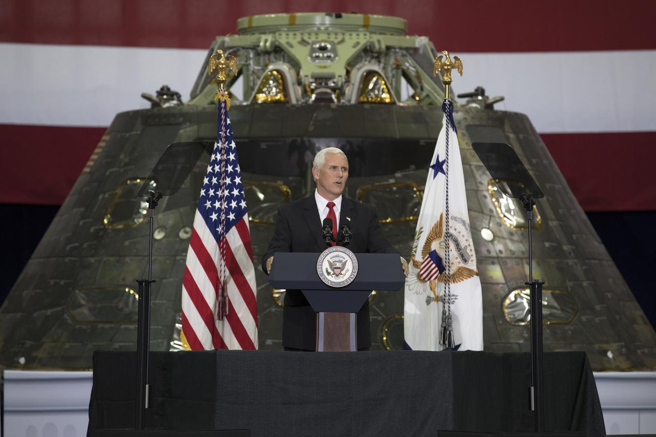 Vice President Mike Pence speaks before an audience of NASA leaders, U.S. and Florida government officials, and employees inside the Vehicle Assembly Building at NASA's Kennedy Space Center in Florida. Pence thanked employees for advancing American leadership in space. Behind the podium is the Orion spacecraft flown on Exploration Flight test-1 in 2014. During his visit to Kennedy, the Vice President also toured several facilities highlighting the public-private partnerships, as both NASA and commercial companies prepare to launch American astronauts from the multi-user spaceport.