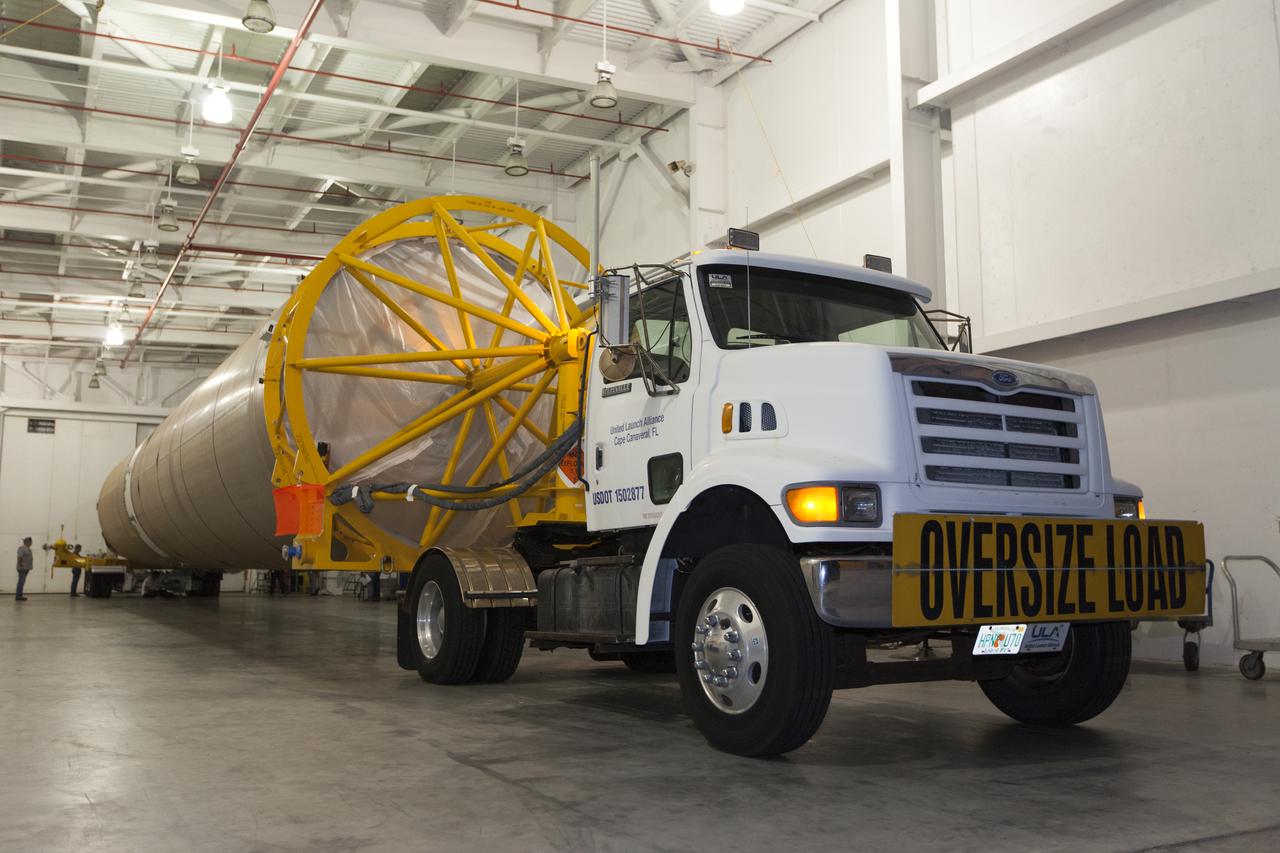 A United Launch Alliance Atlas V first stage is prepared to leave the Atlas Space Operations Center aboard a transport trailer for delivery to the Vertical Integration Facility at Space Launch Complex 41 at Cape Canaveral Air Force Station in Florida. The rocket is scheduled to launch the Tracking and Data Relay Satellite, TDRS-M. It will be the latest spacecraft destined for the agency's constellation of communications satellites that allows nearly continuous contact with orbiting spacecraft ranging from the International Space Station and Hubble Space Telescope to the array of scientific observatories. Liftoff atop the ULA Atlas V rocket is scheduled to take place from Cape Canaveral's Space Launch Complex 41 on Aug. 3, 2017 at 9:02 a.m. EDT.