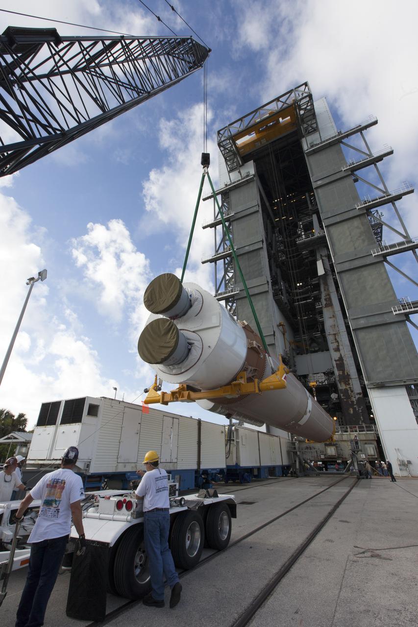United Launch Alliance team members monitor the progress as the operation begins to lift the Atlas V first stage to the vertical position at the Vertical Integration Facility at Space Launch Complex 41 at Cape Canaveral Air Force Station in Florida. The rocket is scheduled to launch the Tracking and Data Relay Satellite, TDRS-M. It will be the latest spacecraft destined for the agency's constellation of communications satellites that allows nearly continuous contact with orbiting spacecraft ranging from the International Space Station and Hubble Space Telescope to the array of scientific observatories. Liftoff atop the ULA Atlas V rocket is scheduled to take place from Cape Canaveral's Space Launch Complex 41 on Aug. 3, 2017 at 9:02 a.m. EDT.