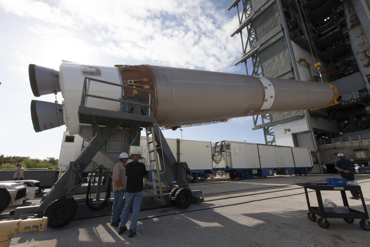 A United Launch Alliance Atlas V first stage is lifted at the Vertical Integration Facility at Space Launch Complex 41 at Cape Canaveral Air Force Station in Florida. The rocket is scheduled to launch the Tracking and Data Relay Satellite, TDRS-M. It will be the latest spacecraft destined for the agency's constellation of communications satellites that allows nearly continuous contact with orbiting spacecraft ranging from the International Space Station and Hubble Space Telescope to the array of scientific observatories. Liftoff atop the ULA Atlas V rocket is scheduled to take place from Cape Canaveral's Space Launch Complex 41 on Aug. 3, 2017 at 9:02 a.m. EDT.