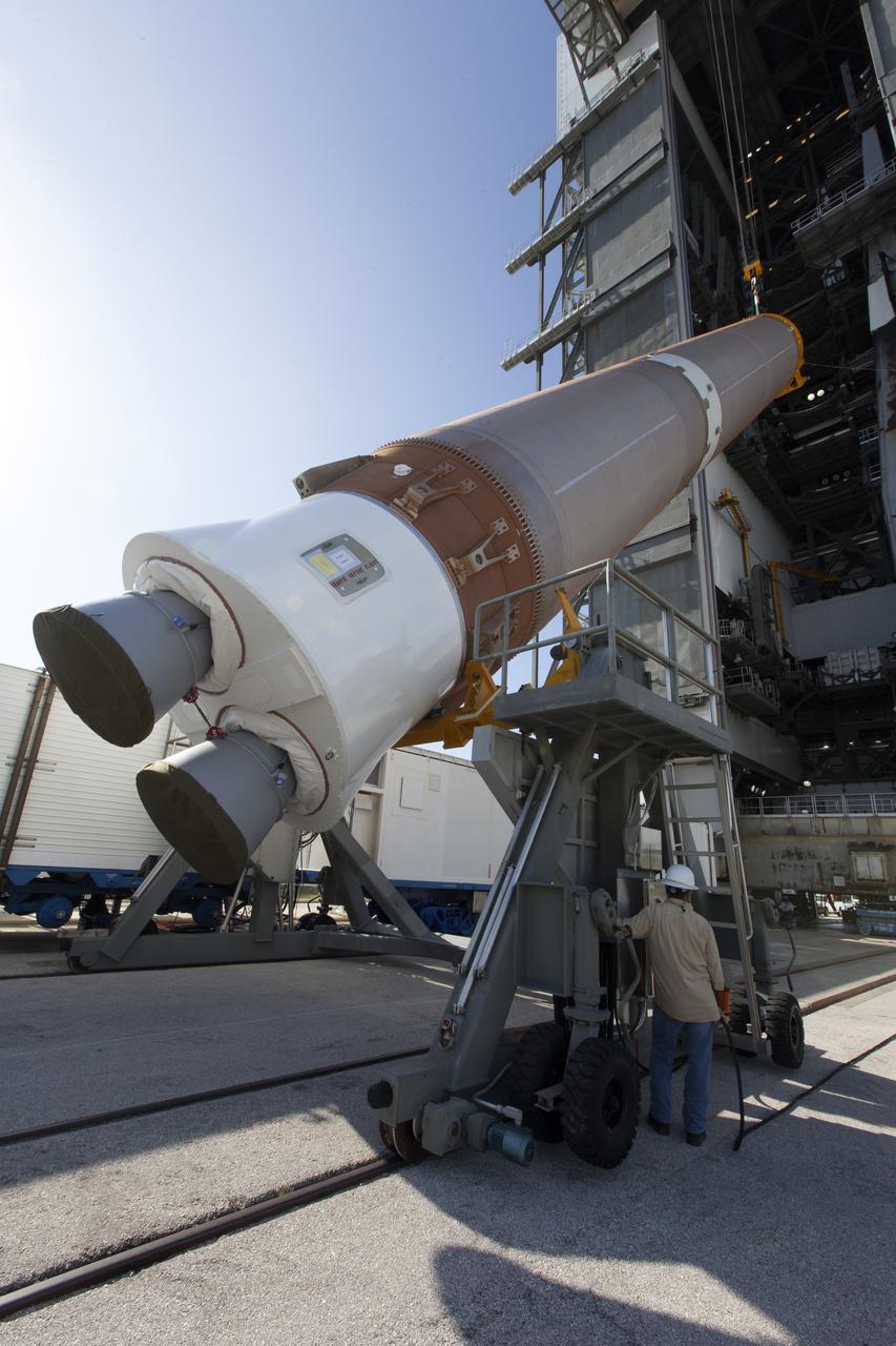A United Launch Alliance Atlas V first stage is lifted at the Vertical Integration Facility at Space Launch Complex 41 at Cape Canaveral Air Force Station in Florida. The rocket is scheduled to launch the Tracking and Data Relay Satellite, TDRS-M. It will be the latest spacecraft destined for the agency's constellation of communications satellites that allows nearly continuous contact with orbiting spacecraft ranging from the International Space Station and Hubble Space Telescope to the array of scientific observatories. Liftoff atop the ULA Atlas V rocket is scheduled to take place from Cape Canaveral's Space Launch Complex 41 on Aug. 3, 2017 at 9:02 a.m. EDT.