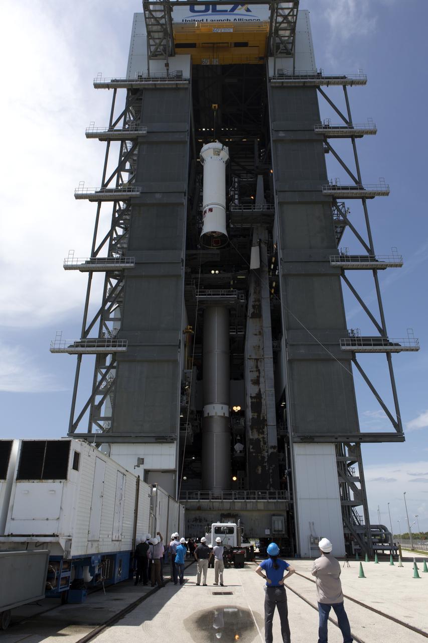 United Launch Alliance team members monitor the progress as the operation begins to lift the Centaur upper stage for mating to its Atlas V booster in the vertical position at the Vertical Integration Facility at Space Launch Complex 41 at Cape Canaveral Air Force Station in Florida. The rocket is scheduled to launch the Tracking and Data Relay Satellite, TDRS-M. It will be the latest spacecraft destined for the agency's constellation of communications satellites that allows nearly continuous contact with orbiting spacecraft ranging from the International Space Station and Hubble Space Telescope to the array of scientific observatories. Liftoff atop the ULA Atlas V rocket is scheduled to take place from Cape Canaveral's Space Launch Complex 41 in early August.