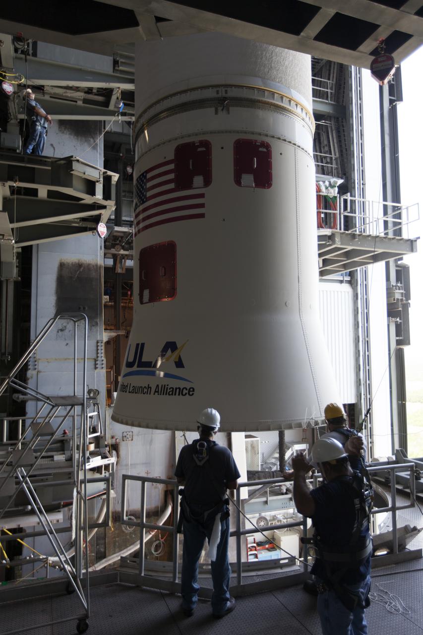 At the Vertical Integration Facility at Space Launch Complex 41 at Cape Canaveral Air Force Station in Florida, United Launch Alliance team members monitor the progress as a Centaur upper stage is positioned prior to mating to an Atlas V booster. The rocket is scheduled to launch the Tracking and Data Relay Satellite, TDRS-M. It will be the latest spacecraft destined for the agency's constellation of communications satellites that allows nearly continuous contact with orbiting spacecraft ranging from the International Space Station and Hubble Space Telescope to the array of scientific observatories. Liftoff atop the ULA Atlas V rocket is scheduled to take place from Cape Canaveral's Space Launch Complex 41 in early August.