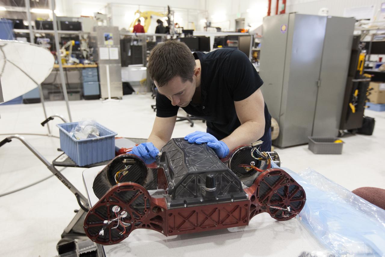 In the Swamp Works laboratory at NASA's Kennedy Space Center in Florida, student interns such as Andrew Thoesen are joining agency scientists, contributing in the area of Exploration Research and Technology. Thoesen is studying mechanical engineering at Arizona State University in Tempe, Arizona. The agency attracts its future workforce through the NASA Internship, Fellowships and Scholarships, or NIFS, Program