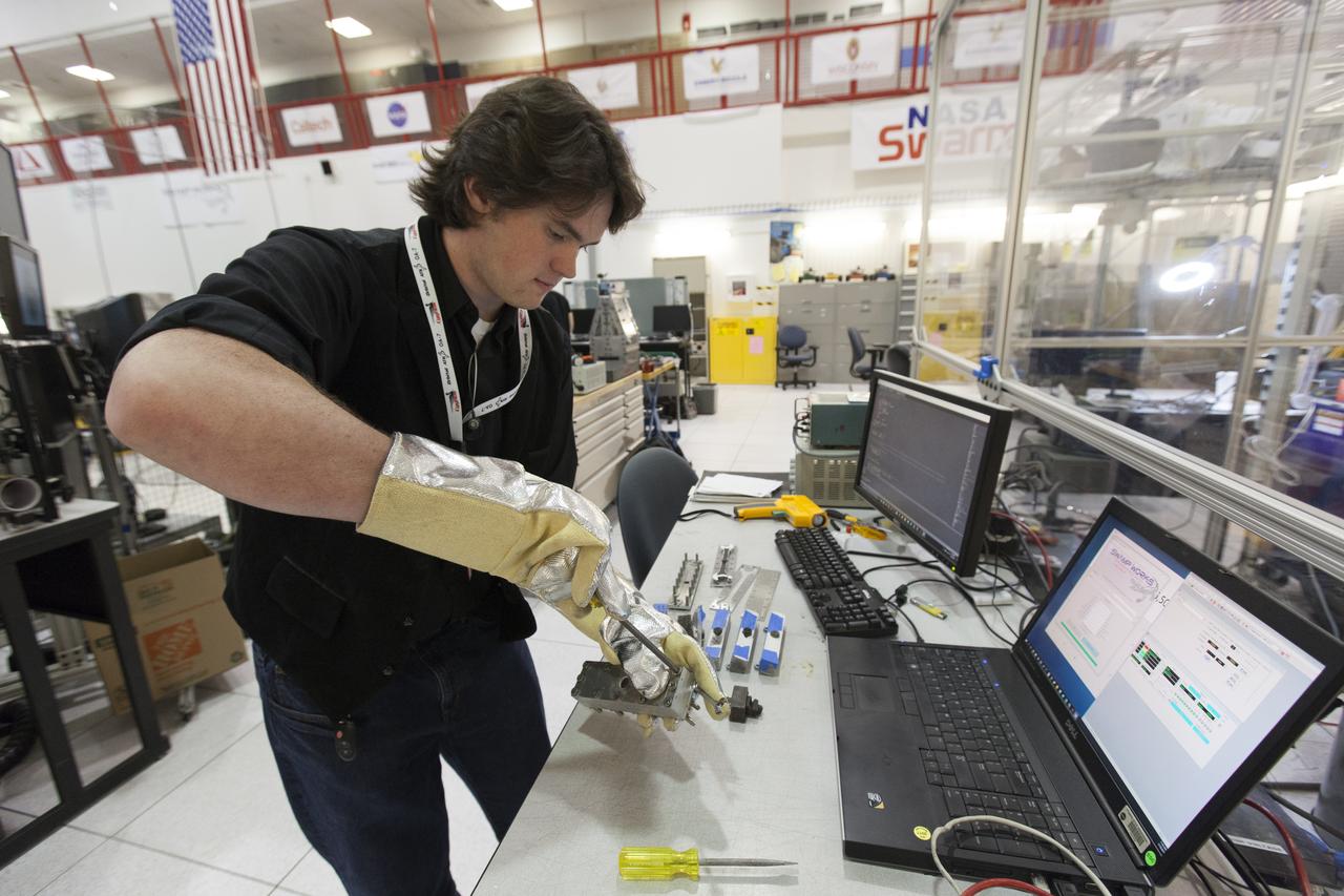 In the Swamp Works laboratory at NASA's Kennedy Space Center in Florida, student interns such as Kevin Murphy are joining agency scientists, contributing in the area of Exploration Research and Technology. Murphy is majoring in mechanical engineering at the University of Illinois at Urbana-Champaign. The agency attracts its future workforce through the NASA Internship, Fellowships and Scholarships, or NIFS, Program.